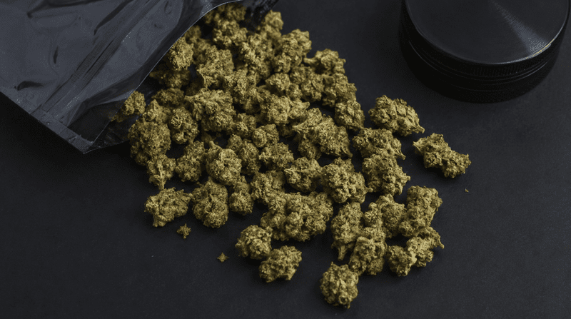 THCA small buds displayed in bulk showing dense trichome-rich cannabis flower